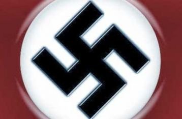 1935 - Jerman Nazi mengadopsi bendera baru yang menampilkan swastika
